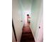 Hallway with hardwood flooring leading to a bedroom with a television and dresser at 2060 Marilyn St # 239, Clearwater, FL 33765