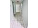 Clean hallway with tile floors and neutral walls at 2060 Marilyn St # 239, Clearwater, FL 33765