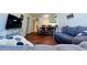 Inviting living room featuring hardwood floors, a comfortable sofa, and an adjacent dining area at 2060 Marilyn St # 239, Clearwater, FL 33765