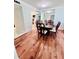 Bright dining area with hardwood floors and kitchen access at 2060 Marilyn St # 239, Clearwater, FL 33765