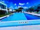 Community pool with lounge chairs and a surrounding patio area at 2060 Marilyn St # 239, Clearwater, FL 33765