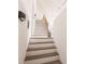 Modern staircase with light wood and white risers at 21048 Peachland Blvd, Port Charlotte, FL 33954