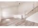 Open living room with vaulted ceiling and wood-look floors at 21048 Peachland Blvd, Port Charlotte, FL 33954