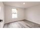 Bright bedroom with wood-look floors and large window at 21048 Peachland Blvd, Port Charlotte, FL 33954
