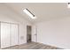 Bright bedroom with wood-look flooring and skylight at 21048 Peachland Blvd, Port Charlotte, FL 33954