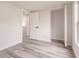 Bright bedroom with wood-look floors and spacious closet at 21048 Peachland Blvd, Port Charlotte, FL 33954