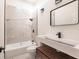 Modern bathroom with marble-look tile and floating vanity at 21048 Peachland Blvd, Port Charlotte, FL 33954