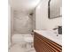 Modern bathroom with marble-look tile and floating vanity at 21048 Peachland Blvd, Port Charlotte, FL 33954