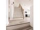 Modern staircase with light wood and white risers at 21048 Peachland Blvd, Port Charlotte, FL 33954