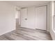 Bright bedroom with wood-look floors and spacious closet at 21048 Peachland Blvd, Port Charlotte, FL 33954