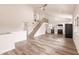 Open living room with vaulted ceiling and wood-look floors at 21048 Peachland Blvd, Port Charlotte, FL 33954