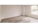 Bright bedroom with wood-look flooring and window at 21048 Peachland Blvd, Port Charlotte, FL 33954