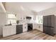 Modern kitchen with stainless steel appliances and white cabinets at 21048 Peachland Blvd, Port Charlotte, FL 33954