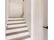 Modern staircase with light wood and white risers at 21048 Peachland Blvd, Port Charlotte, FL 33954