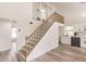 Modern staircase leading to an upper level loft area at 21048 Peachland Blvd, Port Charlotte, FL 33954