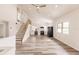 Open living room with vaulted ceiling and wood-look floors at 21048 Peachland Blvd, Port Charlotte, FL 33954