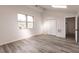 Bright bedroom with wood-look flooring and double closets at 21048 Peachland Blvd, Port Charlotte, FL 33954