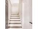 Modern staircase with light wood and white risers at 21048 Peachland Blvd, Port Charlotte, FL 33954