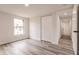 Bright bedroom with wood-look floors and spacious closet at 21048 Peachland Blvd, Port Charlotte, FL 33954