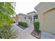 House exterior with paved walkway at 2226 Sifield Greens Way # 26, Sun City Center, FL 33573