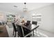 Bright dining room with a dark wood table and four chairs at 2457 Hickman Cir, Clearwater, FL 33761