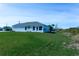 House with a large backyard and green lawn at 285 Porto Alegre St, Punta Gorda, FL 33983