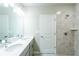 Bathroom with double vanity, large mirror and shower/tub combo at 285 Porto Alegre St, Punta Gorda, FL 33983
