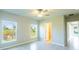 Bright bedroom with ceiling fan, large windows, and tile floors at 285 Porto Alegre St, Punta Gorda, FL 33983
