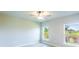 Simple bedroom with two windows and ceiling fan at 285 Porto Alegre St, Punta Gorda, FL 33983