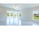 Spacious living room with large windows and tile flooring at 285 Porto Alegre St, Punta Gorda, FL 33983