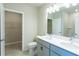 Bathroom with double vanity, large mirror and walk-in shower at 285 Porto Alegre St, Punta Gorda, FL 33983