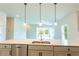 Kitchen island with white quartz countertop and stainless steel sink at 285 Porto Alegre St, Punta Gorda, FL 33983