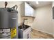 Laundry room with utility sink and overhead cabinets at 3915 W San Pedro St, Tampa, FL 33629