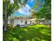 Large backyard with lush green grass and a view of the home at 3915 W San Pedro St, Tampa, FL 33629