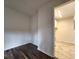Bright bedroom with hardwood floors and access to laundry area at 3915 W San Pedro St, Tampa, FL 33629