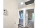 Hallway with thermostat and access to two bedrooms at 3915 W San Pedro St, Tampa, FL 33629