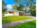 Charming single story home with a lush green front yard at 3915 W San Pedro St, Tampa, FL 33629