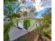 View of house side, showing sliding glass doors and landscaping at 3915 W San Pedro St, Tampa, FL 33629