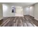 Open concept living room and kitchen with wood-look flooring at 3915 W San Pedro St, Tampa, FL 33629
