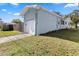 Single car garage with white door and light blue exterior at 4237 Dr Martin Luther King Jr N St, St Petersburg, FL 33703