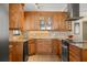 Modern kitchen with wood cabinets and granite countertops at 4237 Dr Martin Luther King Jr N St, St Petersburg, FL 33703