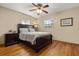 Bedroom with hardwood floors and dark wood furniture at 4237 Dr Martin Luther King Jr N St, St Petersburg, FL 33703