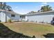 House exterior with light blue siding and backyard patio at 4237 Dr Martin Luther King Jr N St, St Petersburg, FL 33703