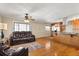 Living room with hardwood floors, leather furniture, and a view of the kitchen at 4237 Dr Martin Luther King Jr N St, St Petersburg, FL 33703