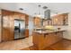 Modern kitchen with wood cabinets, granite countertops and stainless steel appliances at 4237 Dr Martin Luther King Jr N St, St Petersburg, FL 33703