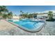 Large community pool with plenty of lounge chairs at 5969 Terrace Park N Dr # 309, St Petersburg, FL 33709