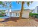 Rear view of house showing patio and landscaping at 604 Angelica Pl, Brandon, FL 33510