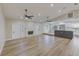 Spacious living area featuring a kitchen island and fireplace at 604 Angelica Pl, Brandon, FL 33510