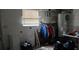 Laundry room with shelving and water heater at 7054 Hibiscus S Ave, South Pasadena, FL 33707