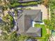 Top-down aerial view of the home highlighting its unique layout and yard at 811 Grove Park Ave, Tampa, FL 33609